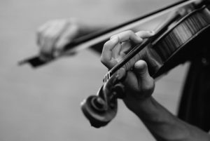 a person playing the violin